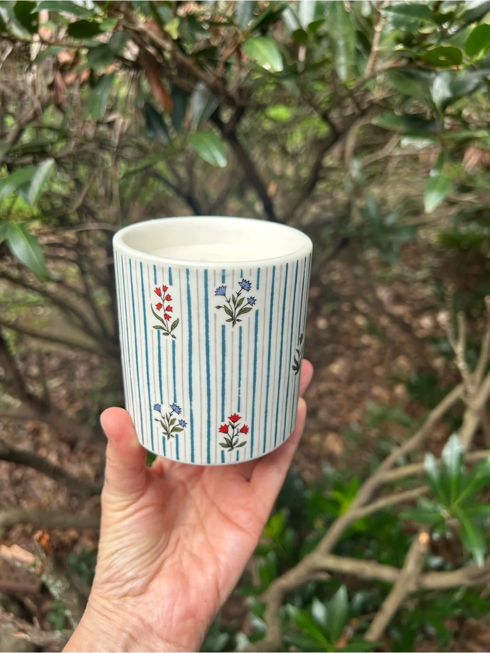 Anthropologie White Ceramic Candle with Blue Stripes and Red Floral Accents